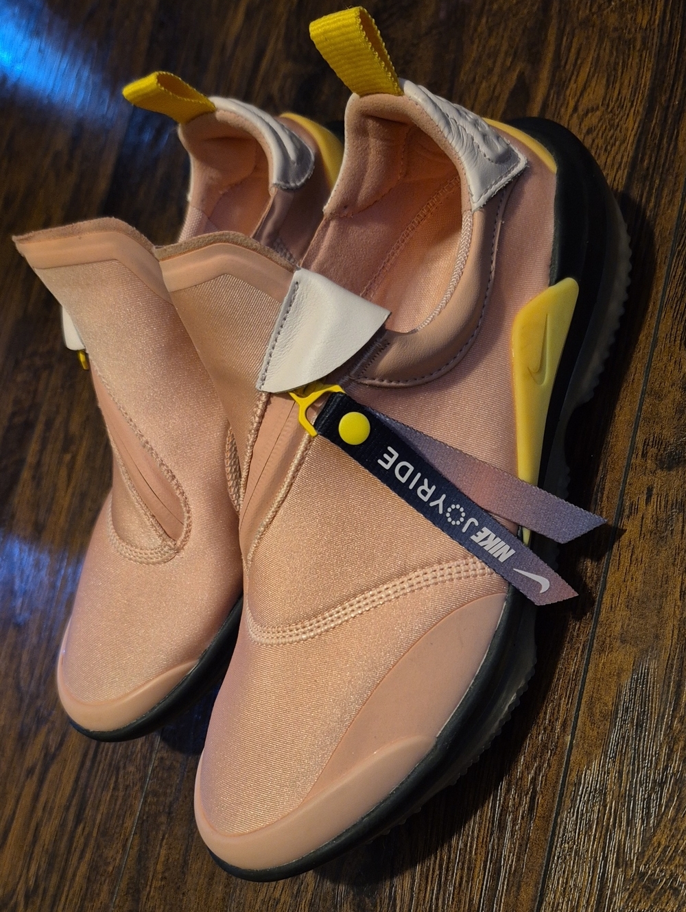 Nike Women’s Pink Slip-On Sneakers with Yellow Accent